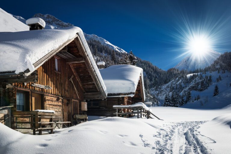 winter ski chalet and cabin in snow mountain  landscape in tyrol austria
